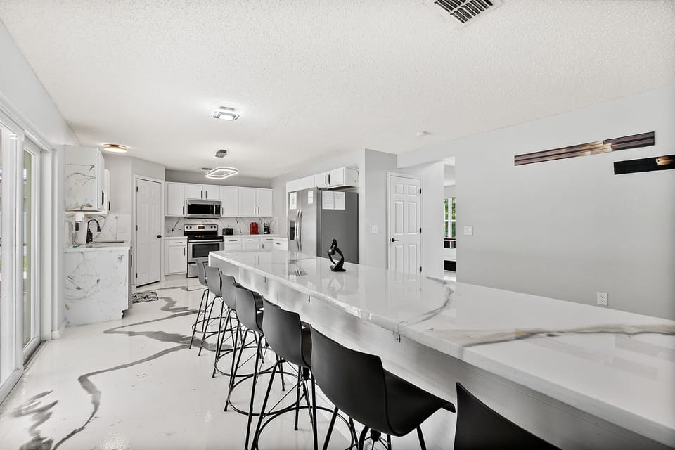 Discover the heart of the home in our modern kitchen, where epoxy designs blend style and functional