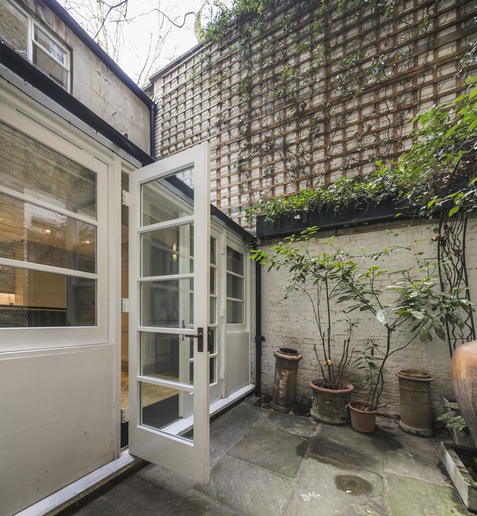 The small courtyard features a water feature, guests can enjoy the peaceful tranquility of the private outside space.