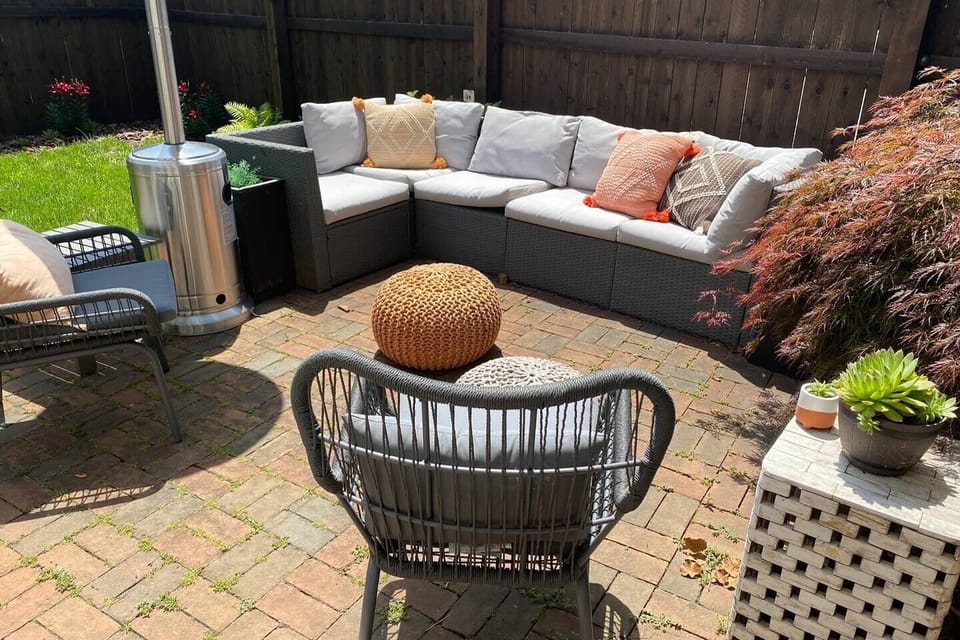 Private, fenced in backyard with heater, grills and seating