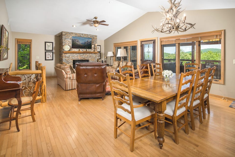 Open layout with fireplace and views.