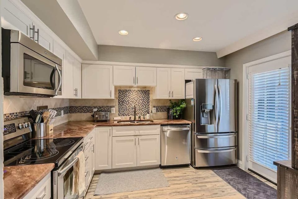 The fully equipped kitchen with stainless steel appliances.
