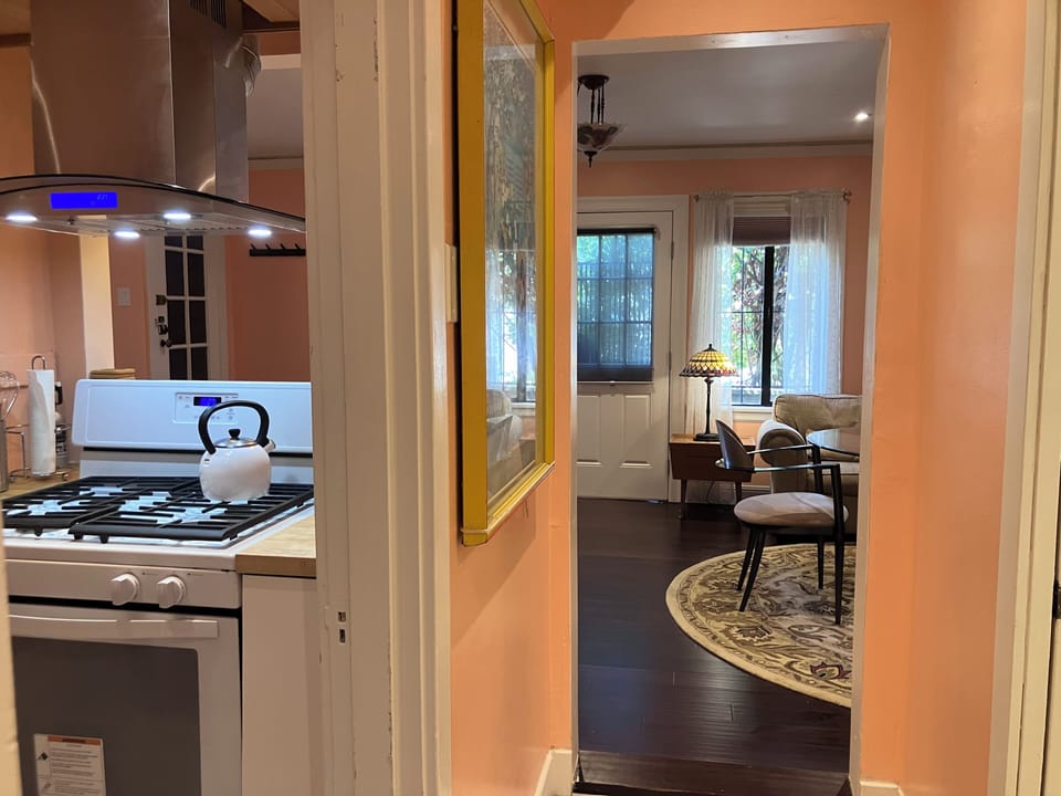 Looking out from hallway to kitchen and big room