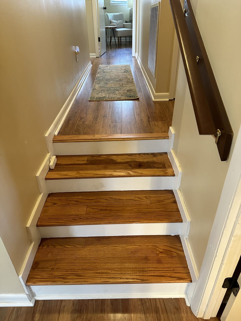 Steps with handrail going up to bedrooms and both bathrooms
