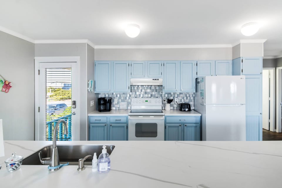 Enter into a lifetime of vacation memories. Kitchen is stocked with all the essentials. Large pantry for groceries.