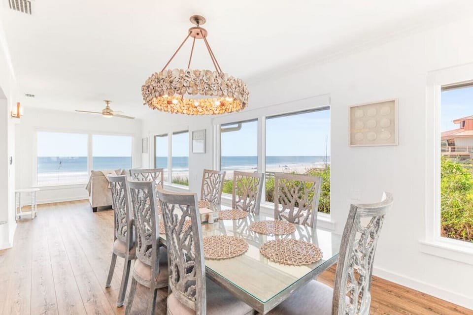 Unique chairs and oyster shell chandelier fit perfectly with the scenery that surrounds you.