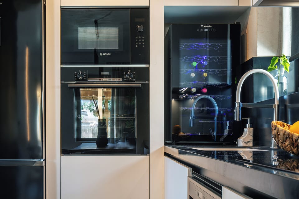 The kitchen includes a wine cooler