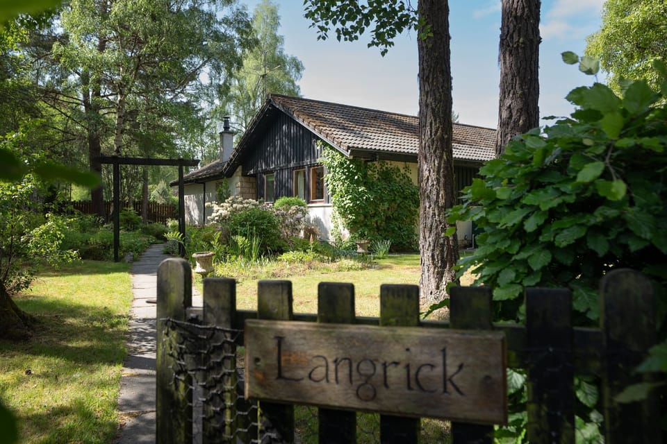 Langrick garden gate and house behind