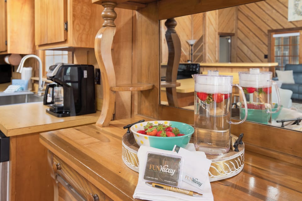 Your fully equipped kitchen welcomes you with fresh strawberries and coffee, ready for cozy mornings and memorable meals together.