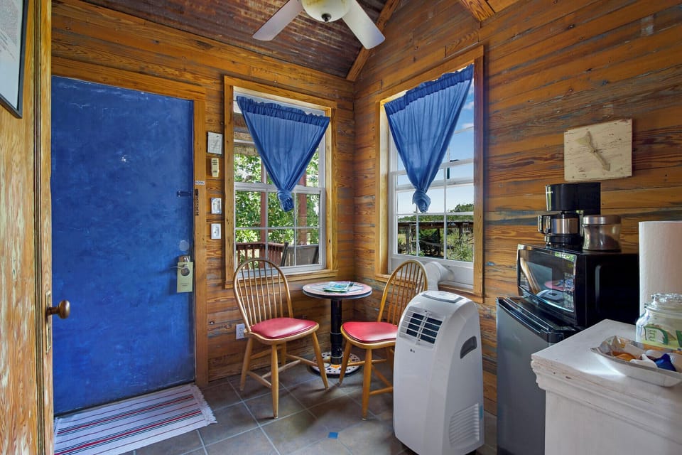 Rear view of the entrance to Honeycomb showing the dining area and kitchenette.