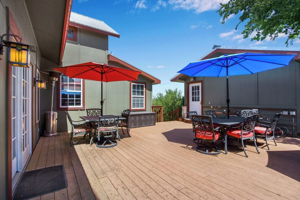 The property has a large shared deck area with lots of tables and seating.
