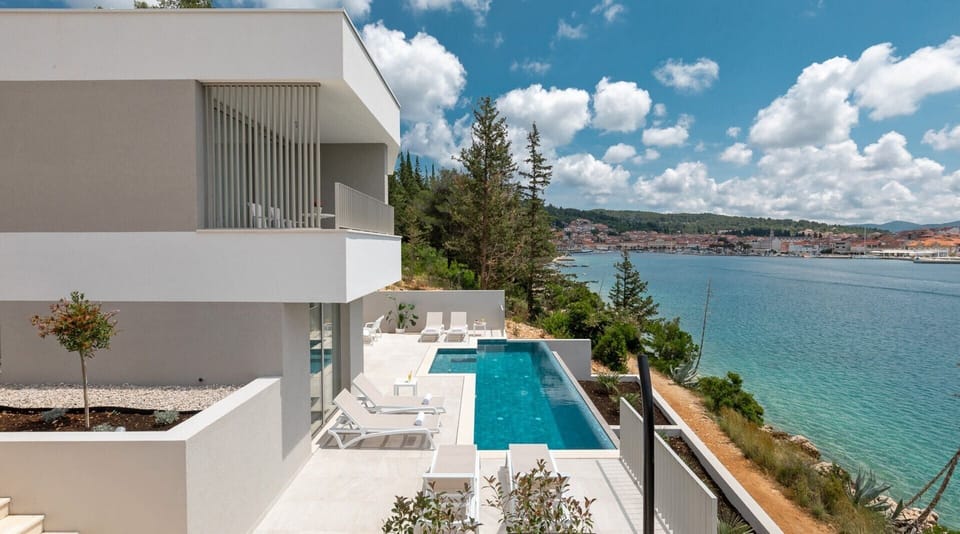 Exterior of Canzona di Mare 1 luxury Croatian vacation rental villa with private infinity pool next to the beach