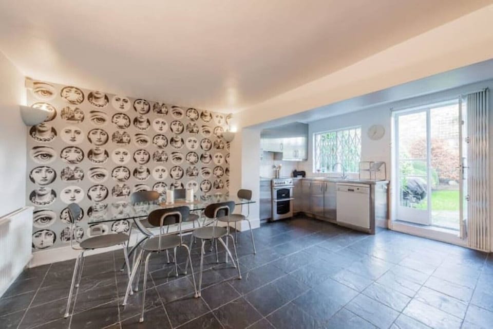 Dining & kitchen with doors to garden