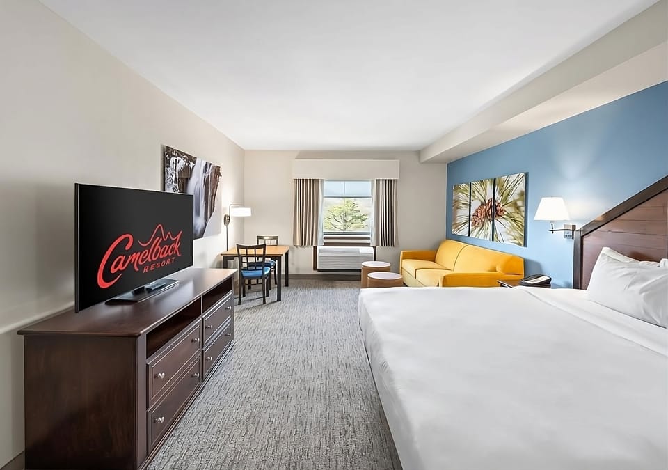 Recharge in a spacious suite with lounge seating and big TV.