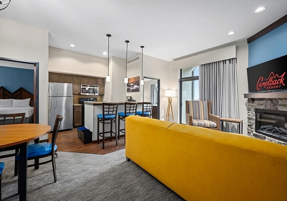 Step into a bright suite with fireplace and open layout.