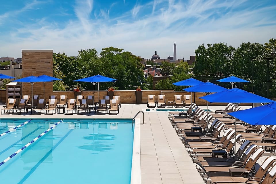 Unwind poolside with panoramic city views and crisp water.