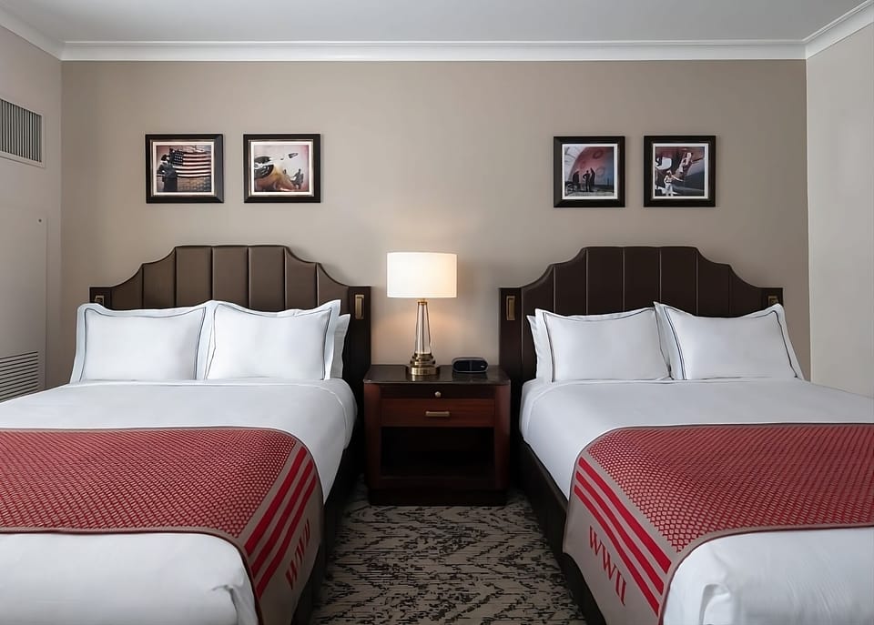 Recharge together in a cozy double room with warm lighting.