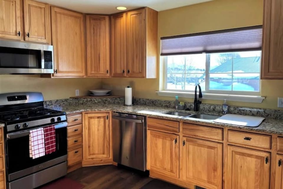 Stainless steel refrigerator, dishwasher, microwave, and range/oven combination