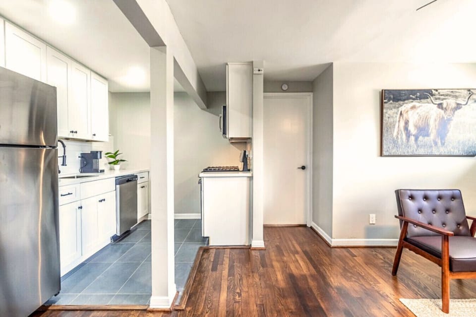 Modern kitchen space with stainless steel appliances and an easy flow into the living area.