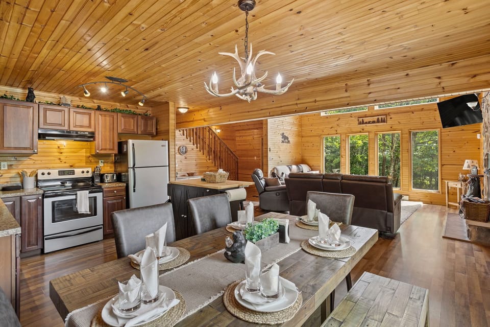 The kitchen, dining, and living areas flow together effortlessly, creating a spacious and inviting environment for guests to relax and gather.