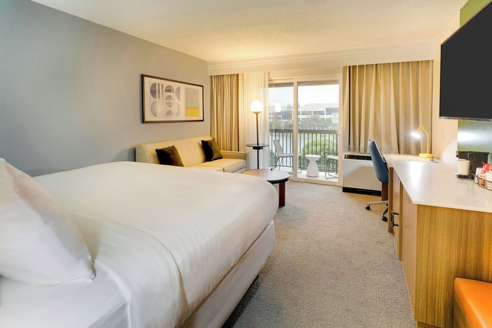 Settle in with a spacious layout, desk, and smart TV.