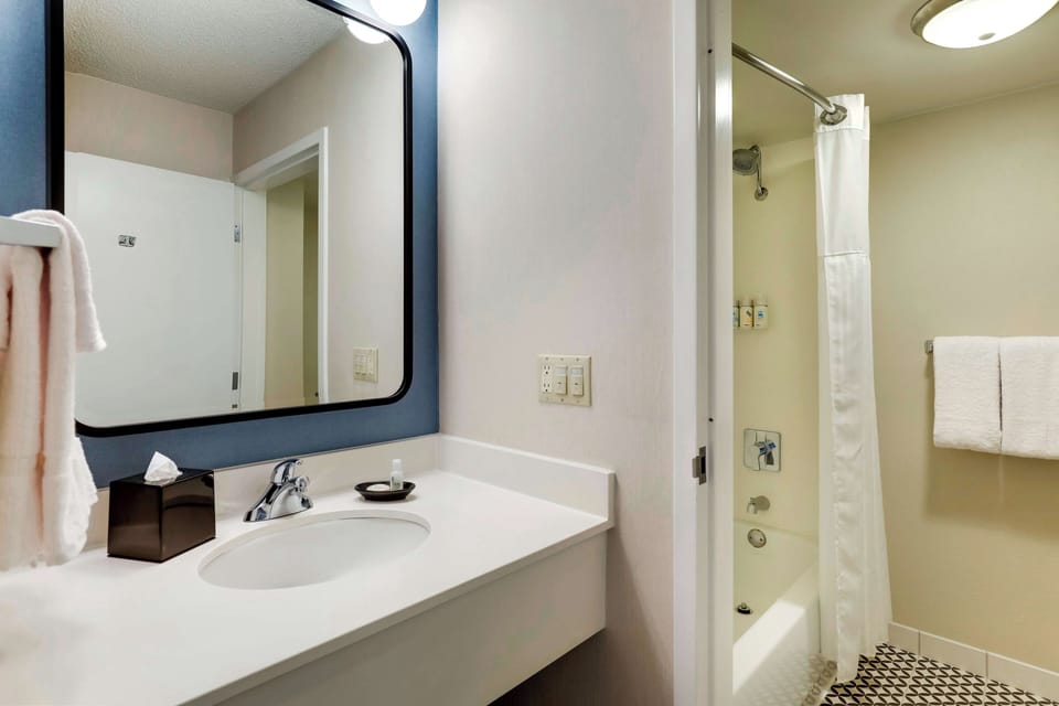 Rinse off in the shower-tub combo with fresh towels ready.