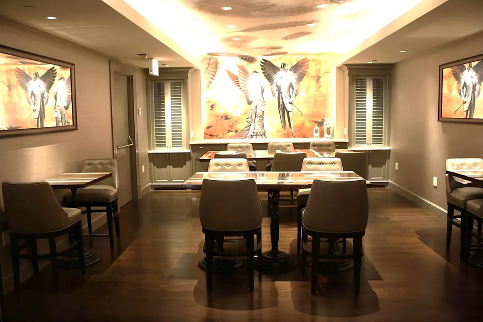 Gather for cocktails in a warm, art-filled lounge.