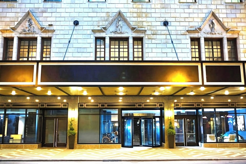 Arrive under glowing marquee lights to a grand entrance.