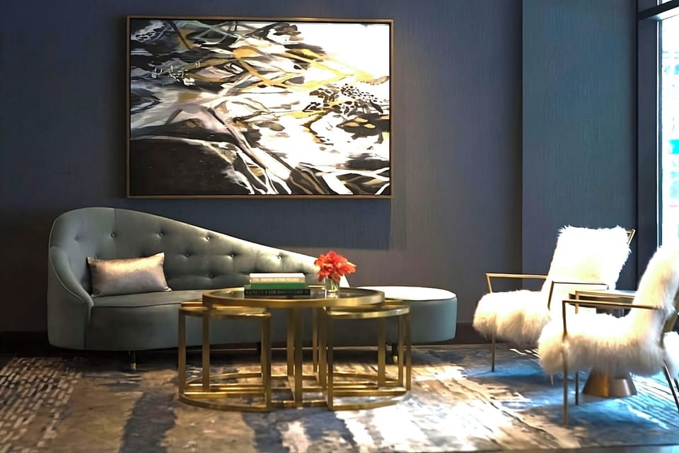 Sink into plush seating beneath bold, gallery-style artwork.