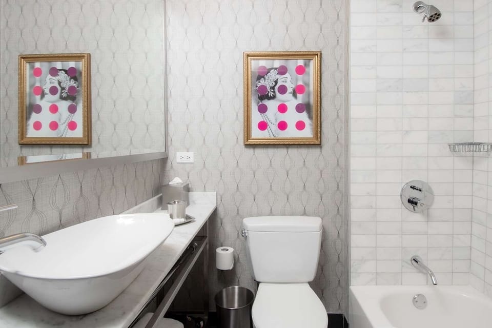 Soak and reset in a spotless bath with modern tilework.