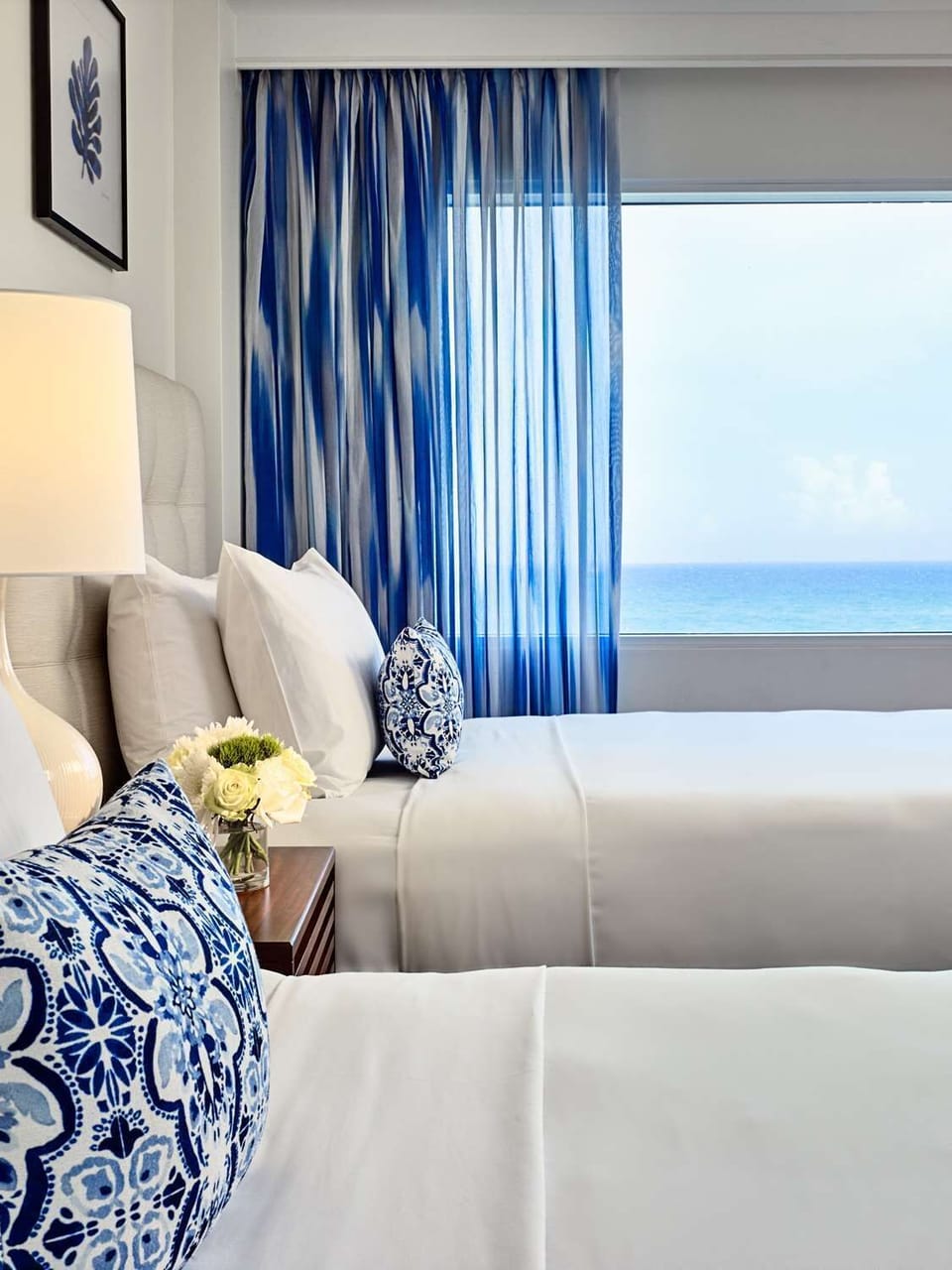 Drift off with crisp linens and a dreamy blue horizon.