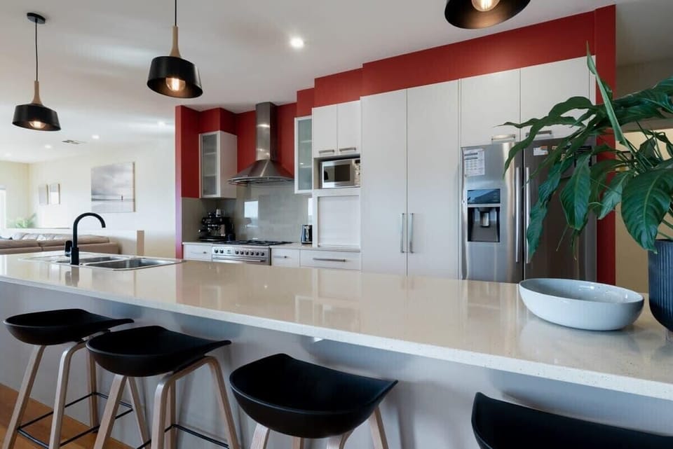 Fully appointed kitchen featuring sleek designs and modern appliances