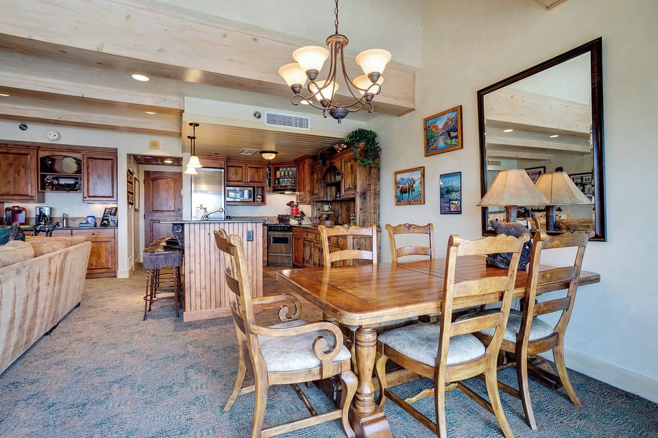 Gather around your elegant dining table where warm wood tones and thoughtful details create the perfect setting for memorable meals together.