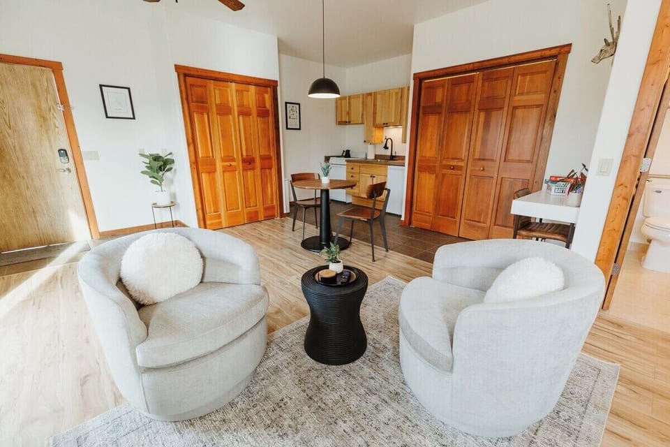 [Living area] Our suite features high-quality furniture from brands like West Elm and Crate & Barrel.