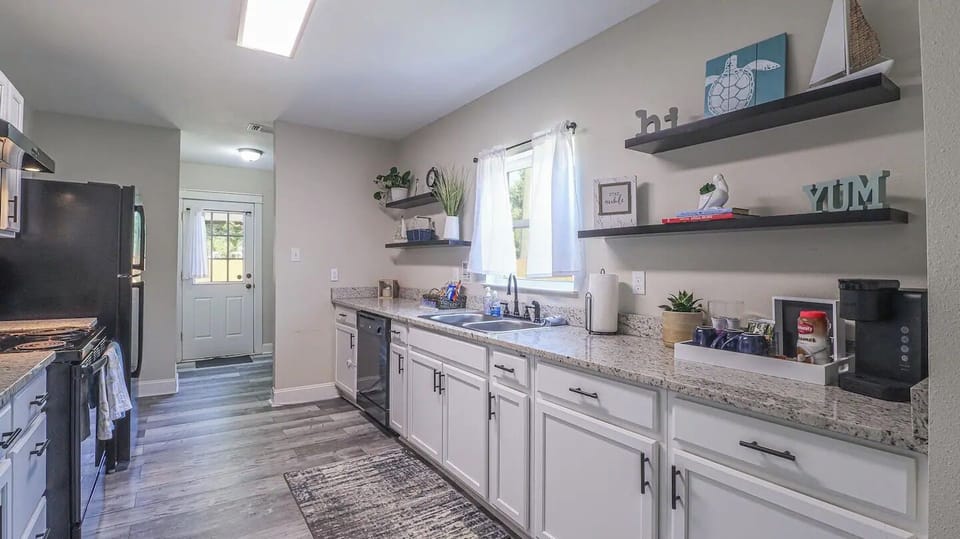Where Culinary Wonders Unfold: A Sleek and Well-Equipped Kitchen

