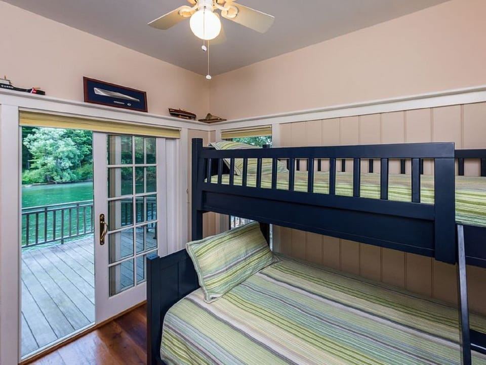 Downstairs bunk room with a full size bed on the bottom and a twin top.