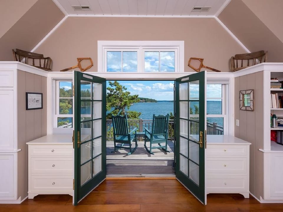 Master bedroom with king size bed and private balcony deck.
