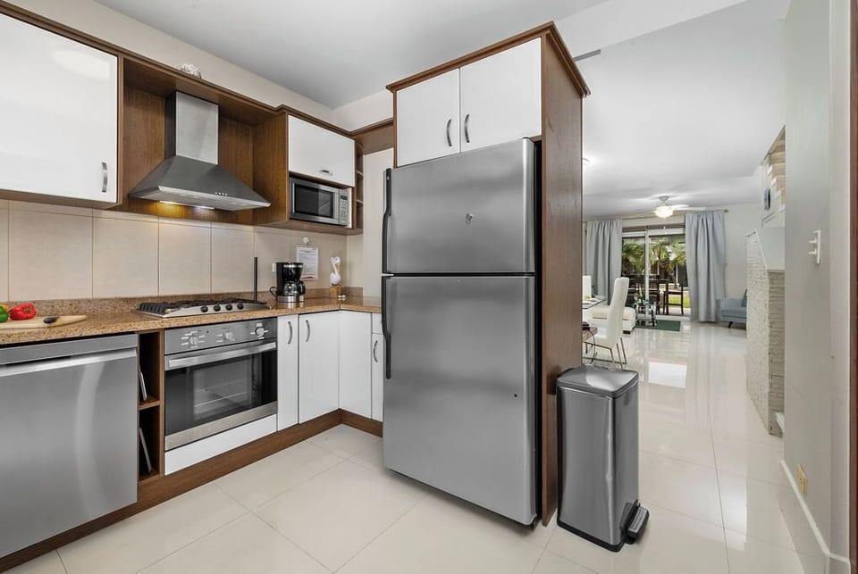 Step into a modern, fully equipped kitchen designed to make meal preparation a pleasure. Whether you're whipping up a quick breakfast or preparing a gourmet dinner, you'll have everything you need at your fingertips