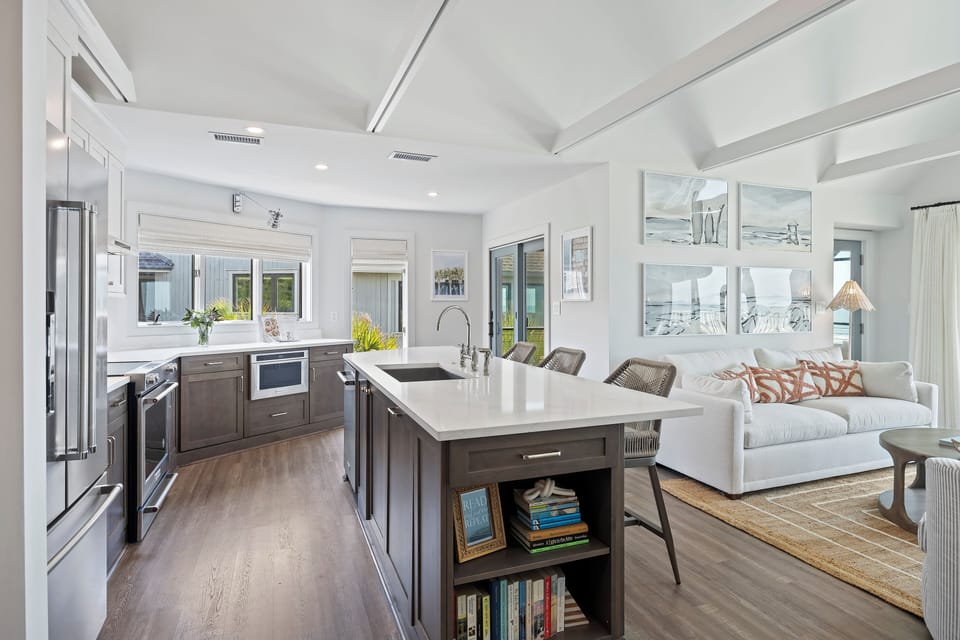 Upgraded and fully equipped kitchen with island seating and open to the living room.  Easy to cook and socialize with your group.