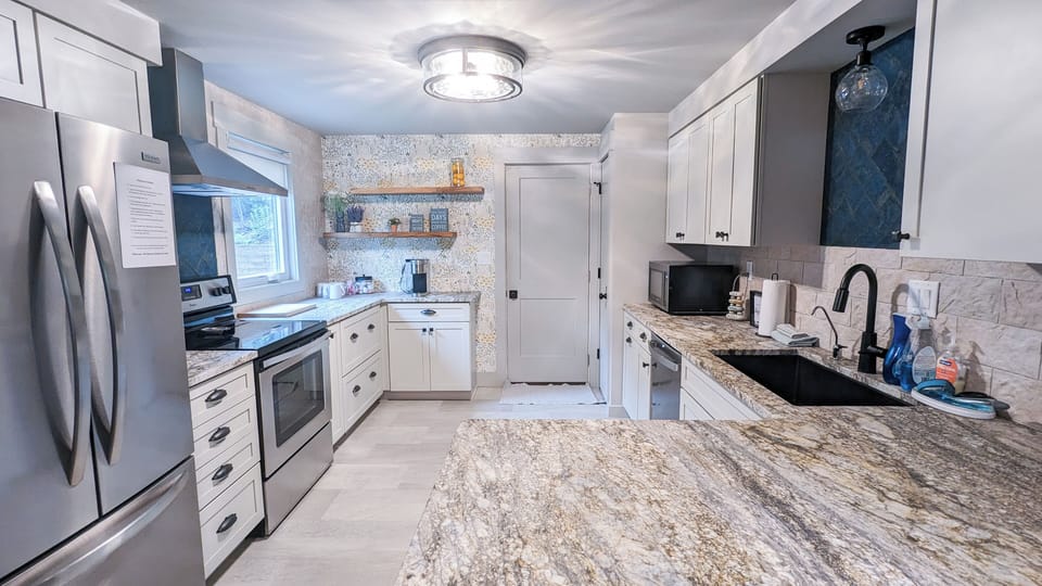 Granite countertops, new cabinetry and stainless appliances