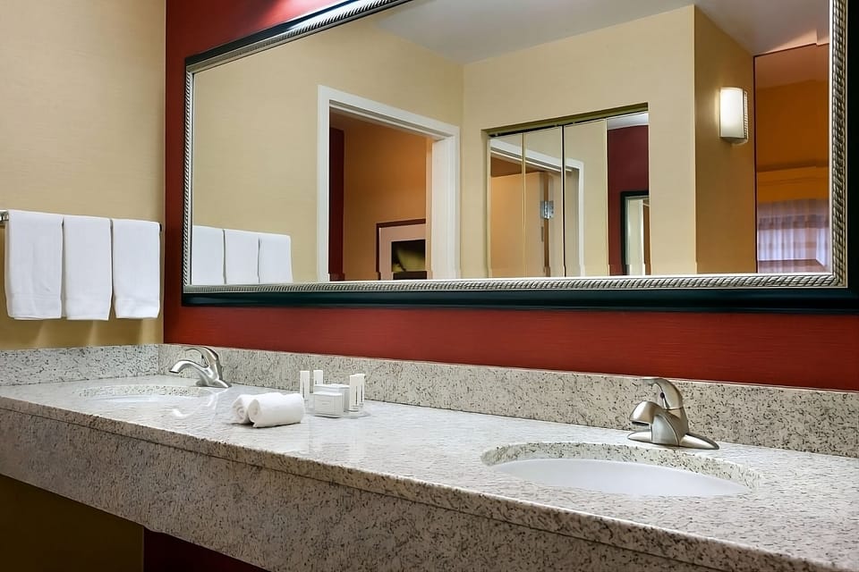 Refresh at a spacious double vanity with bright mirrors.