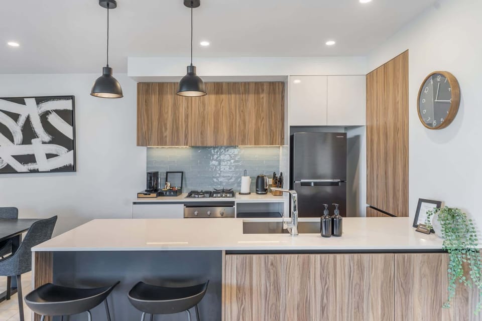 Kitchen with modern appliances and breakfast bar.