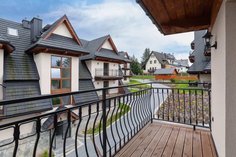 A second balcony offering picturesque views of the surrounding architecture and mountain charm.

