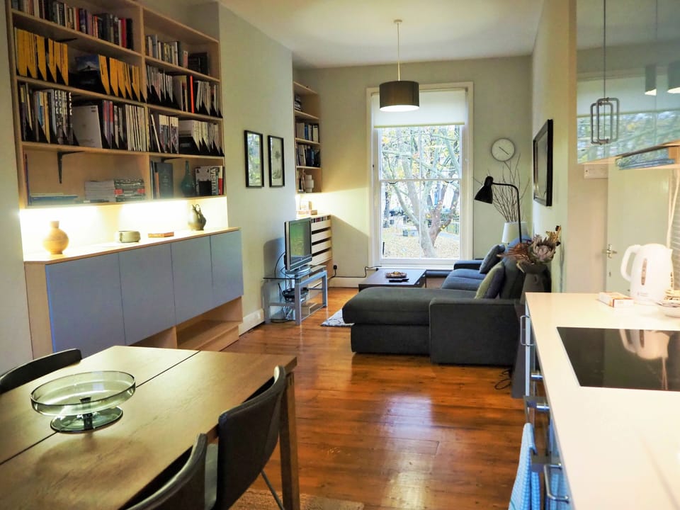 Stylish open plan kitchen and living room overlooking park