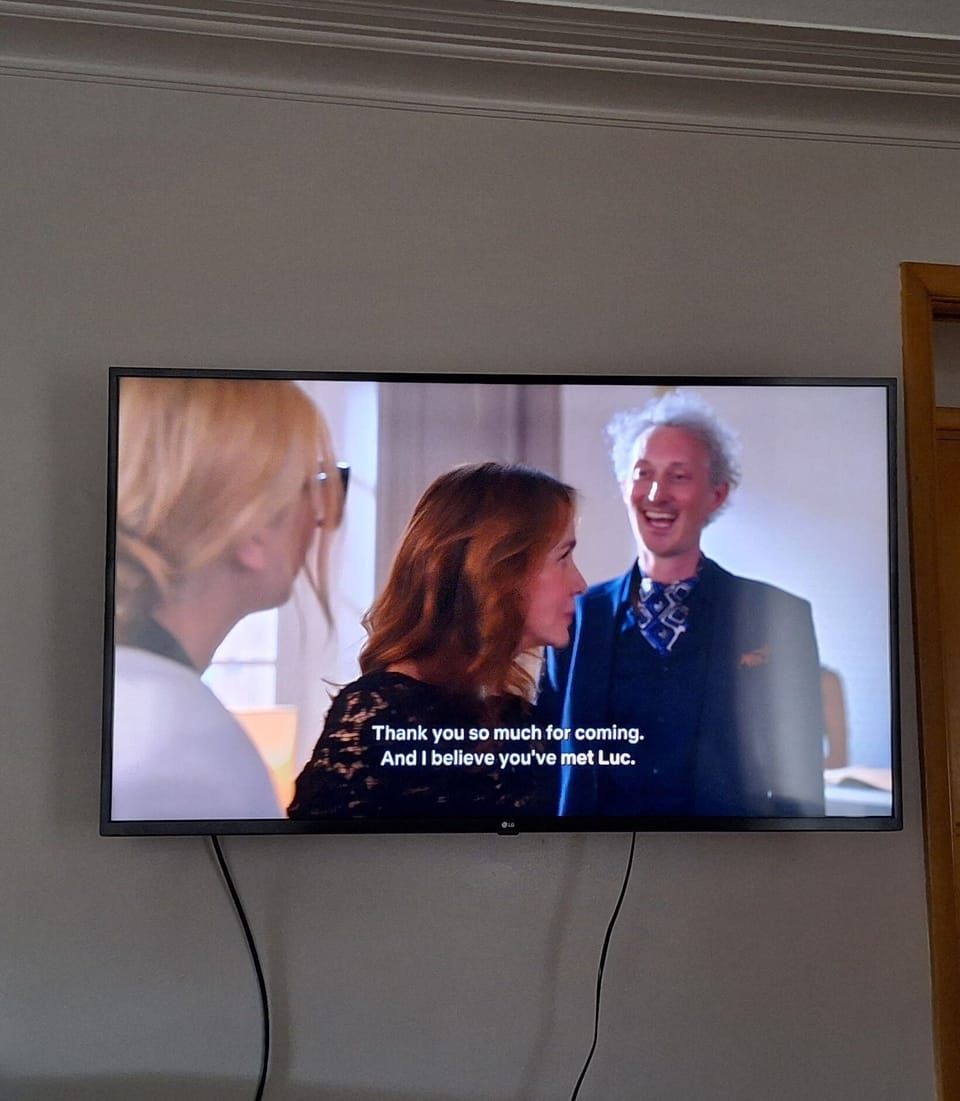 Living room has a 55" smart TV.