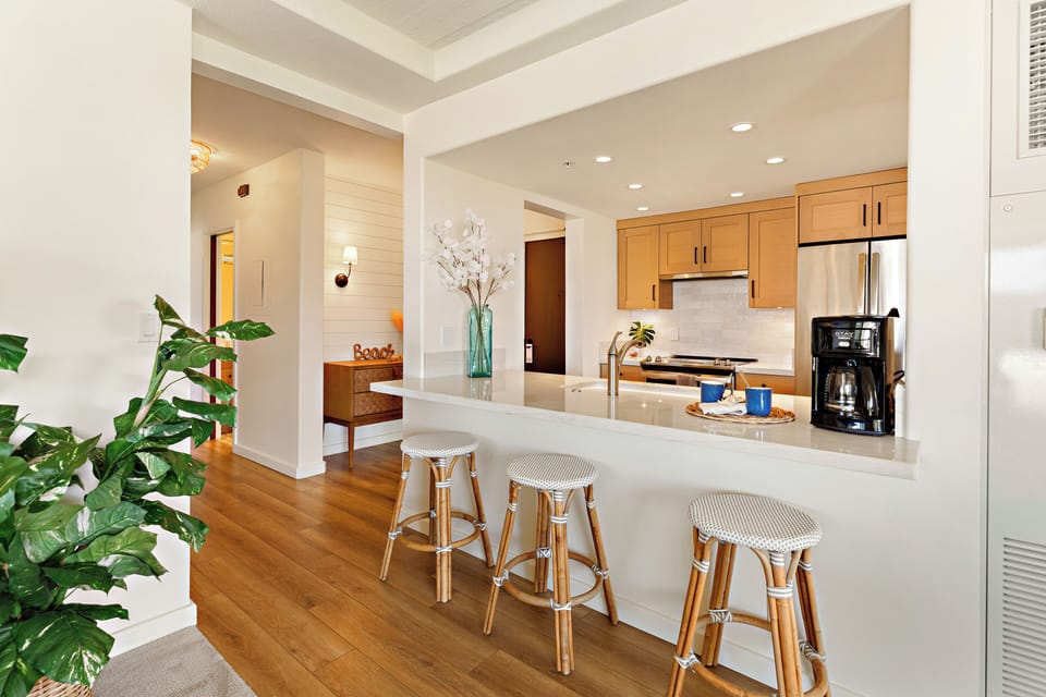 Designed for both functionality and entertaining, the open-concept kitchen seamlessly connects to the living and dining areas for effortless Maui living.