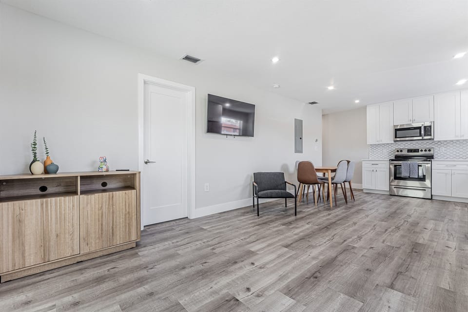 Catch your favorite TV show while cooking dinner in this open concept floor plan