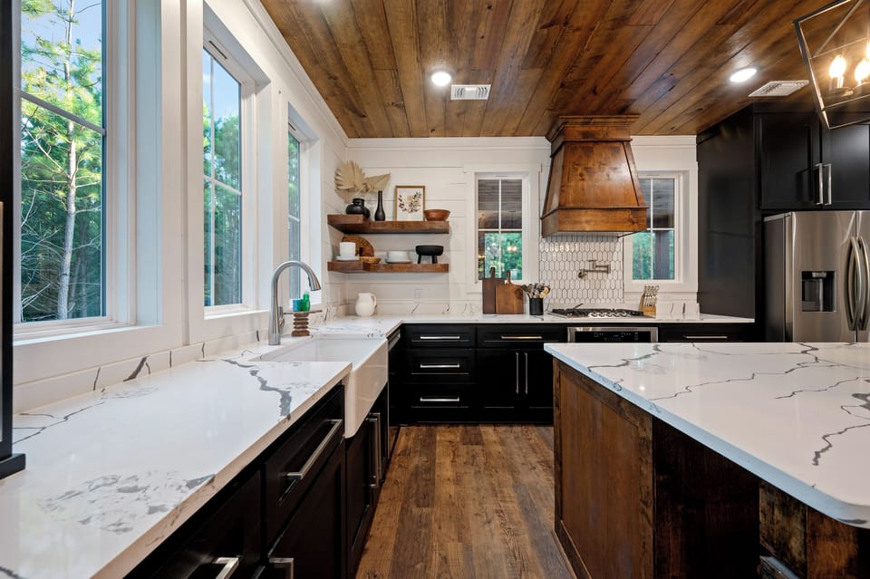 Farmhouse style sink and all the needed items to cook your favorite meals. 