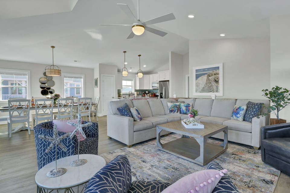 The seamless flow between the living, dining, and kitchen areas creates the ultimate space for entertaining.