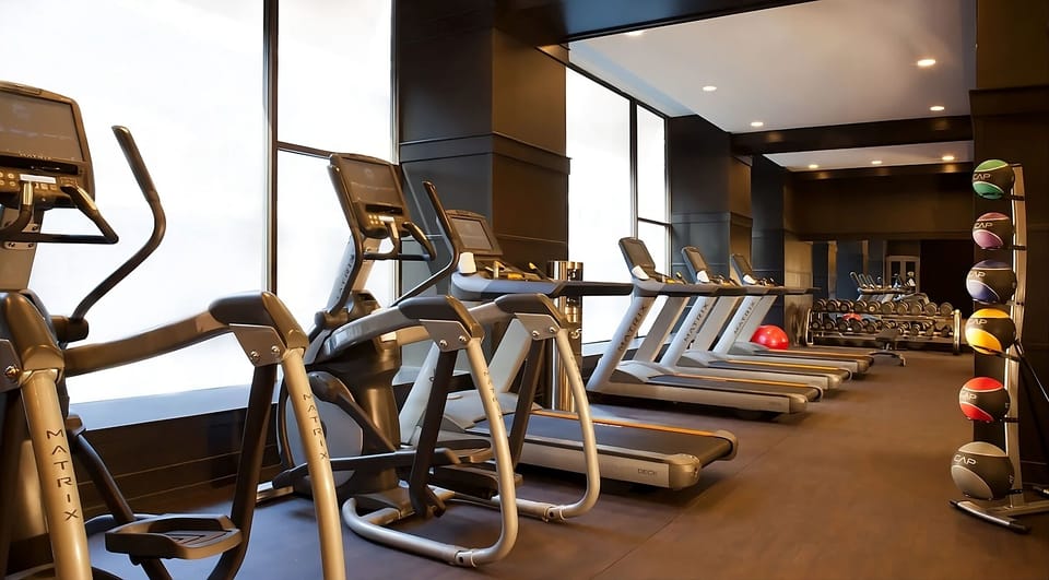 Recharge with a bright gym and full cardio lineup.