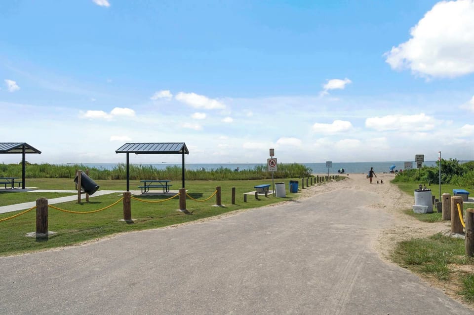 Beach Access Path: Take a scenic stroll to the sandy shores just minutes from your getaway!
